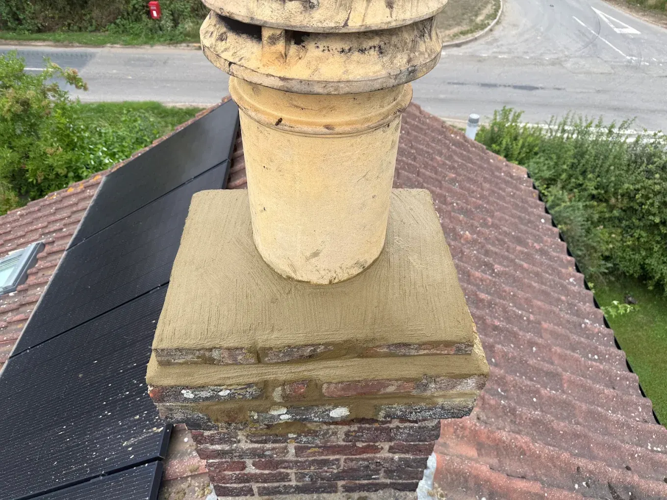 Chimney stack with new mortar flaunching around the pot