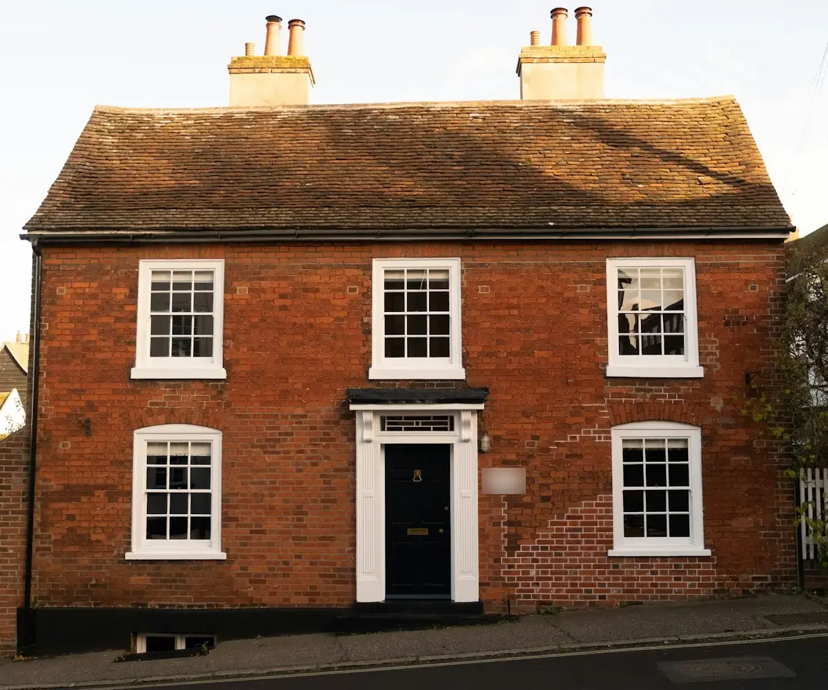 Red-brick period house with sash windows